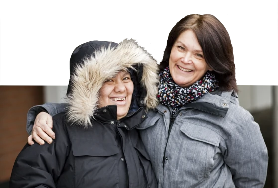 Photo of a happy caregiver and her client