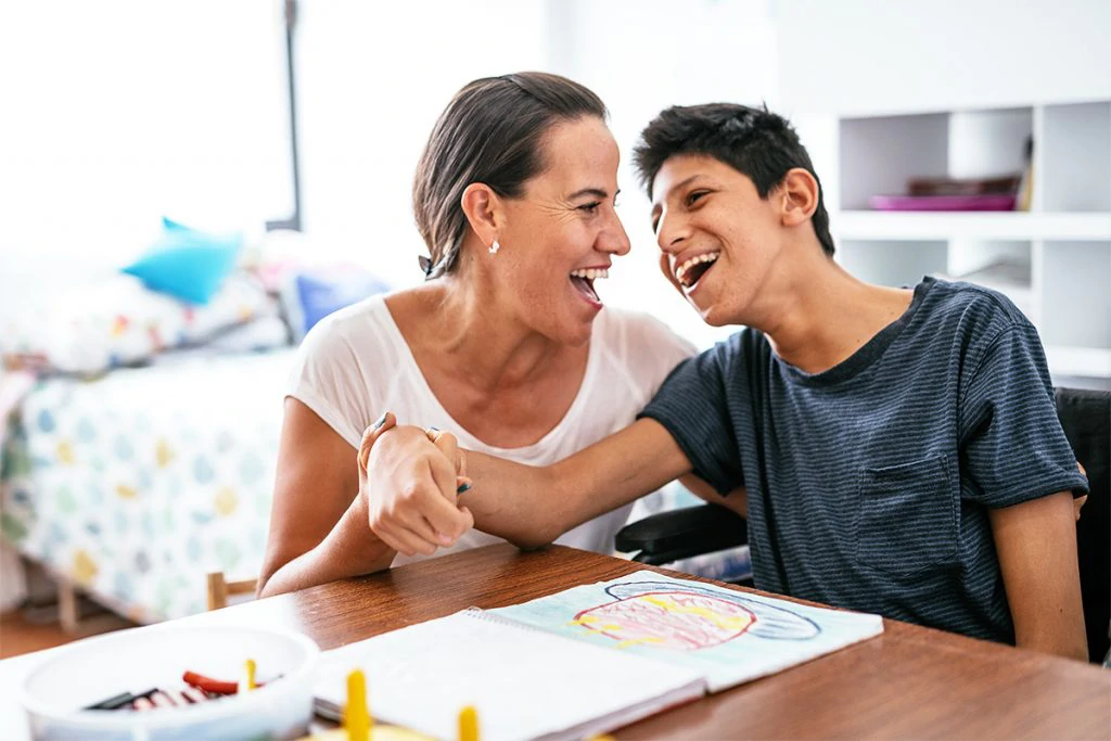 Photo of a special needs caregiver with her client