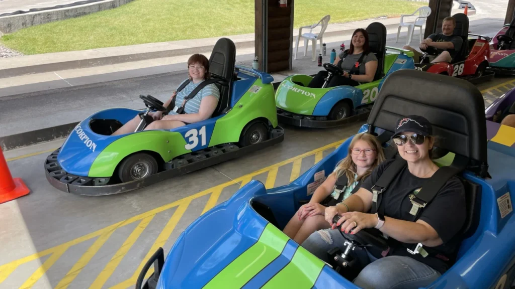 Accra client Colette and her family go karting on a family vacation