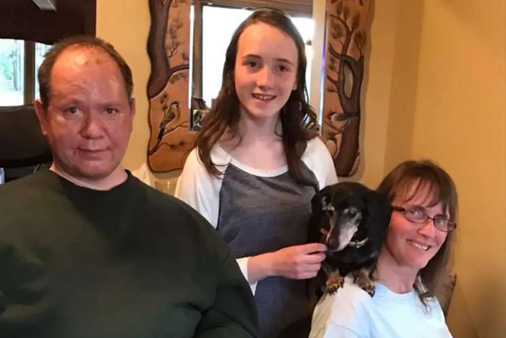 Brian, LeeAnna and Savanna with their family dog